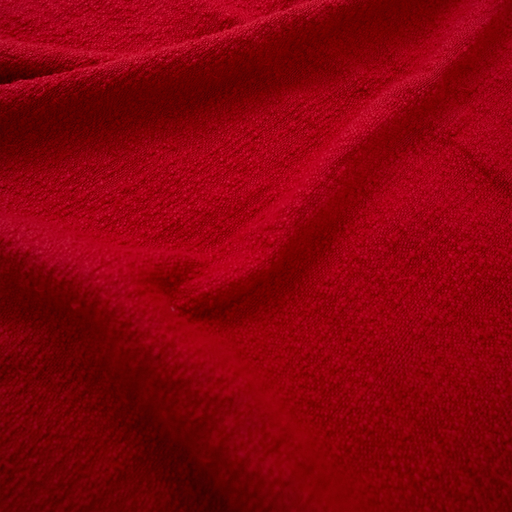 Close-up of red fouta with a textured surface