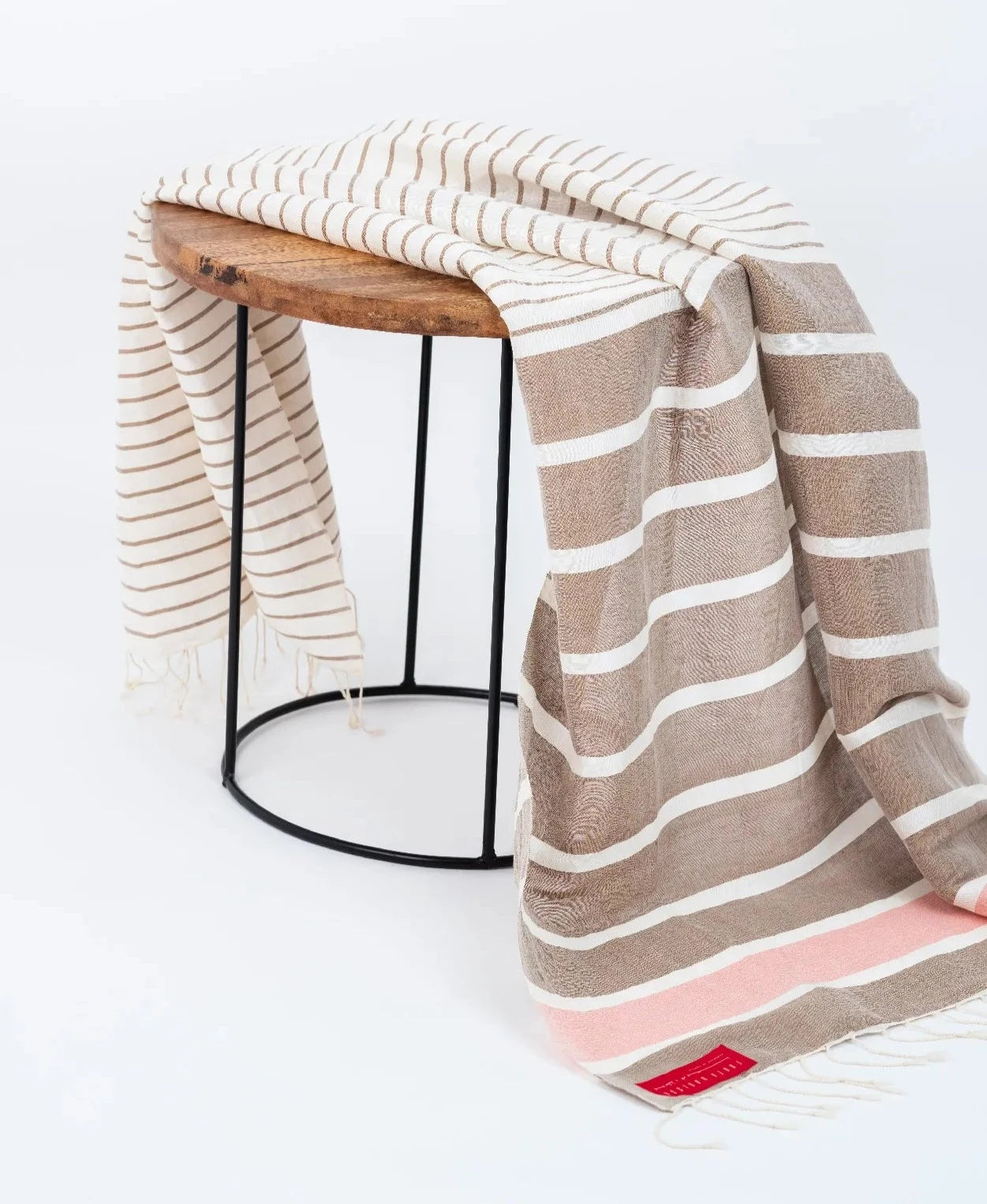 Ripple Effect Fouta Draped over wooden side table