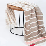 Ripple Effect Fouta Draped over wooden side table